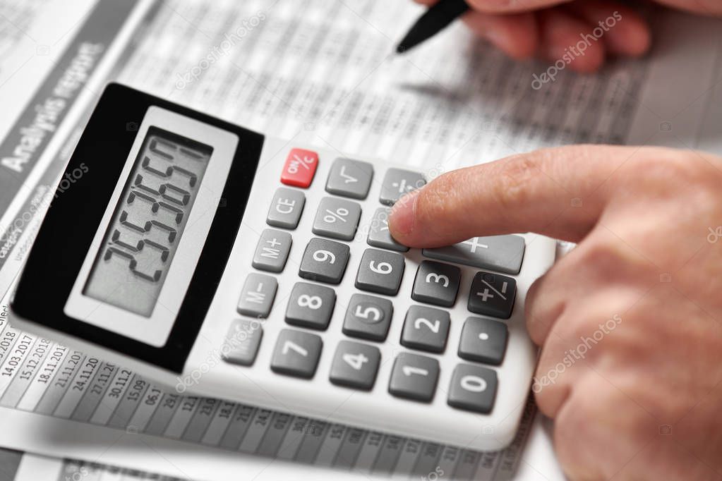 Businessman working and calculating finance. Business financial accounting concept. Closeup hands.