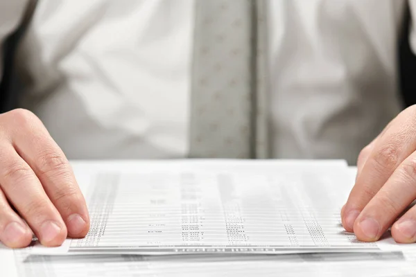 Businessman working in an office. Hands and documents closeup. Stock Image