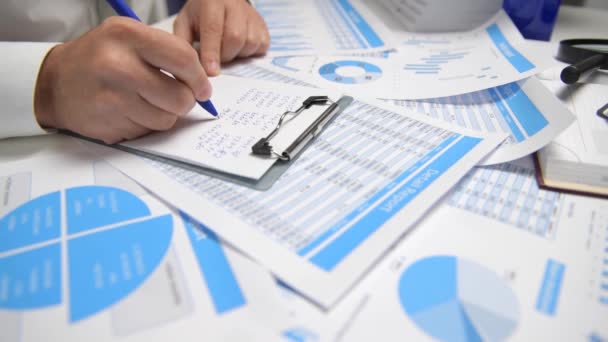 Businessman Working Calculating Reads Writes Reports Office Employee Table Closeup — Stock Video