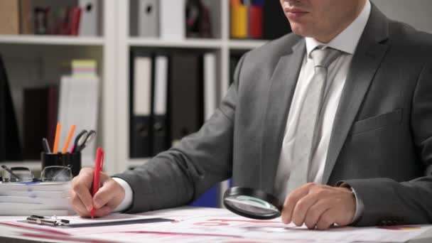 Businessman Working Calculating Reads Writes Reports Office Employee Table Closeup — Stock Video