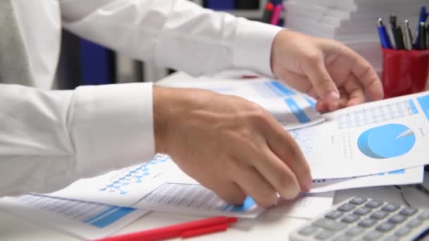 Businessman Working Calculating Reads Writes Reports Office Employee Table Closeup — Stock Video