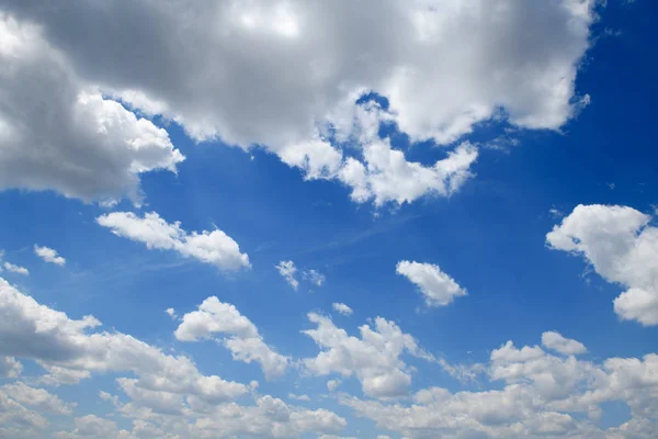 Bright beautiful blue sky with clouds for background or texture — Stock Photo, Image