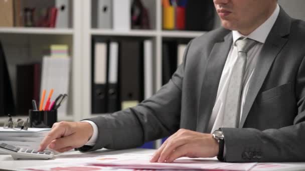 Businessman Working Calculating Reads Writes Reports Office Employee Table Closeup — Stock Video