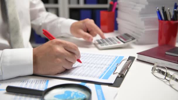 Businessman Working Calculating Reads Writes Reports Office Employee Table Closeup — Stock Video