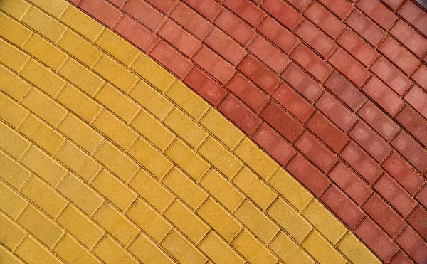 Azulejo de pavimentación marrón amarillo y rojo para fondo o textura — Foto de Stock