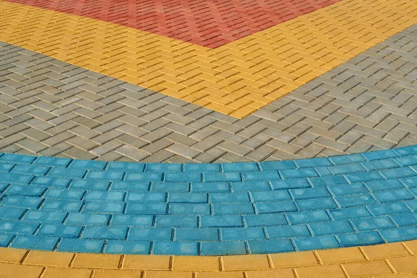 Yellow, red and blue paving tiles for background or texture — Stock Photo, Image