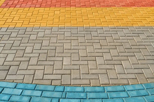 Yellow, red and blue paving tiles for background or texture — Stock Photo, Image