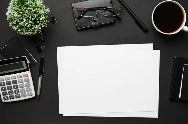 Top View Modern Black Office Desk Blank Paper Sheet Notebook — Stock Photo, Image