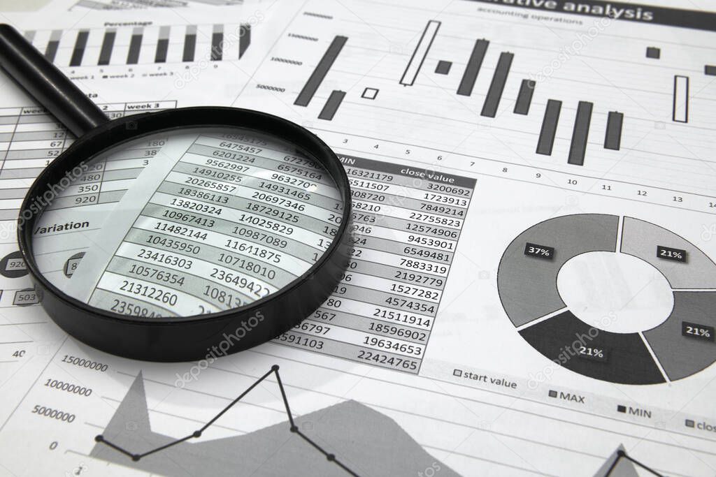 business office desk closeup informes financieros, análisis y