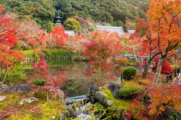 Autumn foliage garden and pond at Eikando temple, Kyoto, Kansai, Japan. Tourist travel destination landmarks in fall.