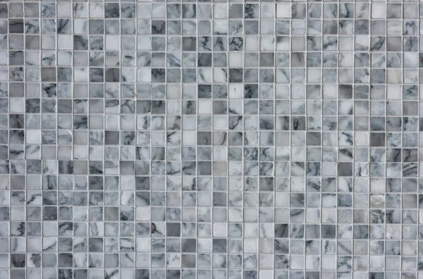 White and gray marble wall tiles for textured background. Modern or antique house interior