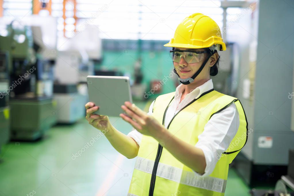 Inspector using tablet in manufactoring  factory