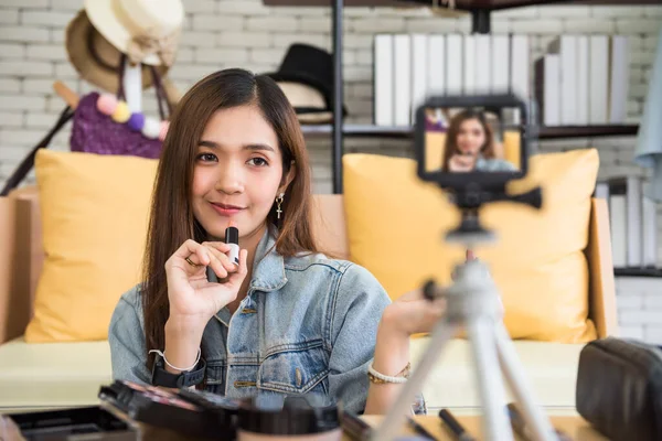 live streaming video camera of Beauty blogger woman lipstick makeup. internet influencer or vlogger recording daily make-up routine tutorial for online content.