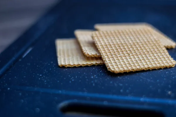 Ice cream cookies on a cutting board.