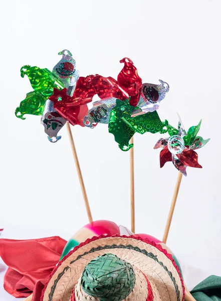 Pinwheels, hat and mexican flag, decoration for Mexican Independence Day on white background