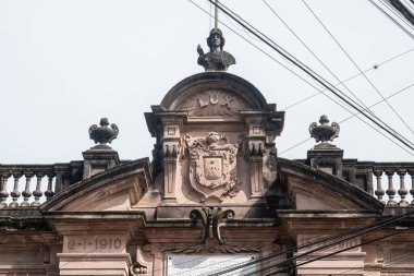 XALAPA, VERACRUZ, MEXICO- AUGUST 1, 2025: Detail of thefacade of Escuela Industrial Concepcion Quiros Perez at a sunny day in Xalapa, Veracruz, Mexico
