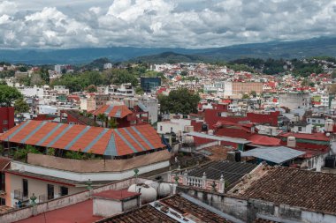 XALAPA, VERACRUZ, MEXICO- AUGUST 1, 2025: Panoramic view of Xalapa city from Parque Juarez at a sunny day