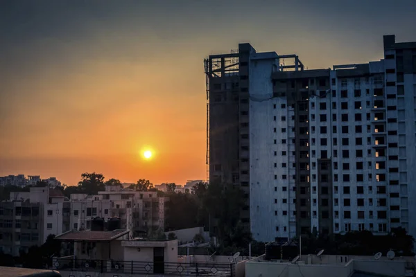 Silhouette of construction site at sunset