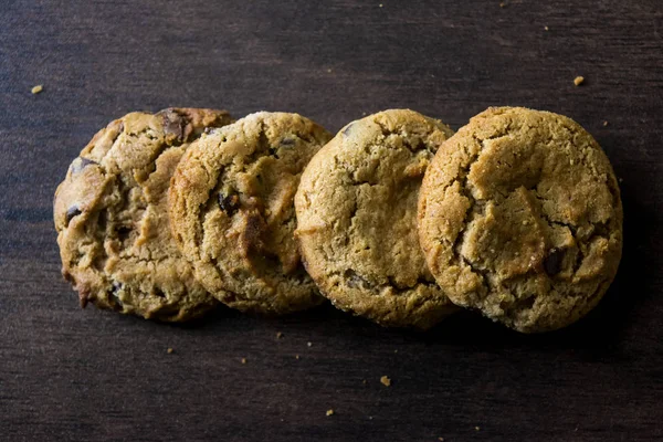 Cookies on dark wooden background