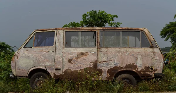 Texture of cracked paint and rust on car. Abandoned cars.