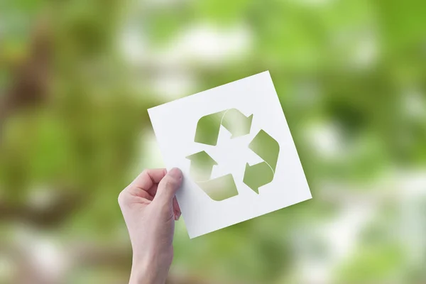 Hand Holding Cut Paper Logo Recycle Blur Green Nature Background — Stock Photo, Image
