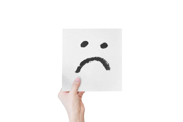 Hand Holding White Paper Hand Drawn Unhappy Face Emoticons Isolated — Stock Photo, Image