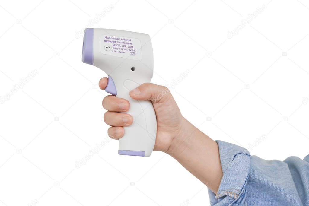 Hand holding digital infrared thermometer (thermometer gun) Isolated on white background with clipping path. For check forehead temperature measurement scan. 