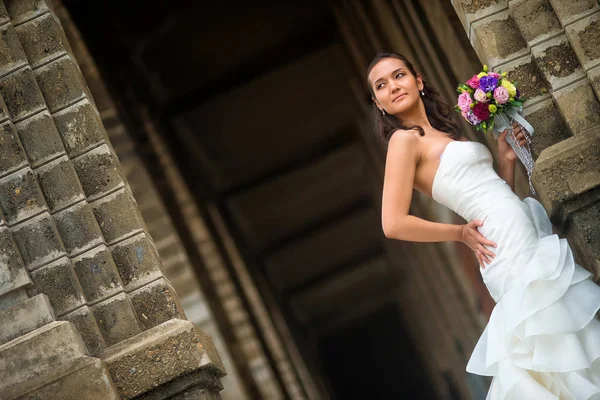 Bride Stands Stone Wall Beautiful White Wedding Dress — Stock Photo, Image