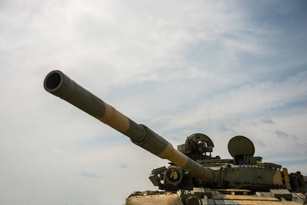 RUSSIA, TOGLIATTY - AUGUST 13, 2018: Big gun of an old Soviet military tank on sky backround