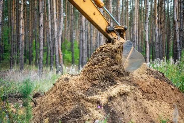 Excavator performs excavation work by digging the ground with a bucket