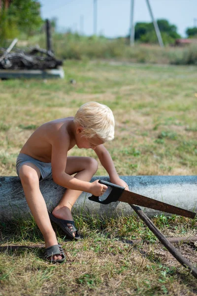 Young Boy Shirt Sitting Tube Sawing Branch Saw Countryside — Stock Photo, Image