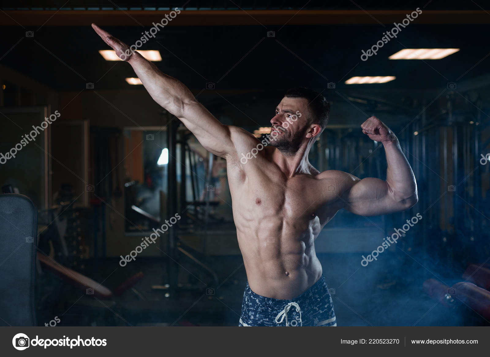 Muscular Man Resting After Exercise And Drinking From Shaker Stock Photo by  ©roman.l.olegovic 300463622