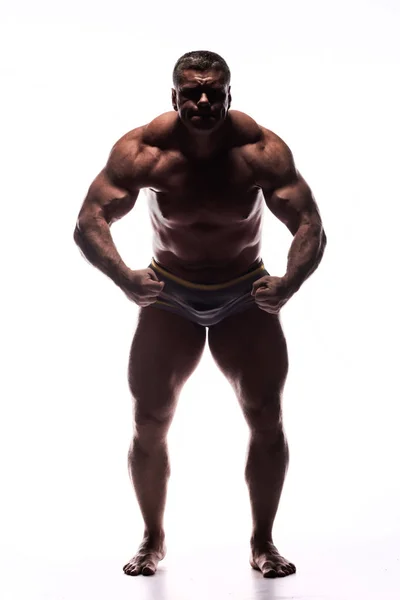 Gran Hombre Poderoso Mostrando Sus Músculos Estudio Sin Camisa Sobre —  Fotos de Stock
