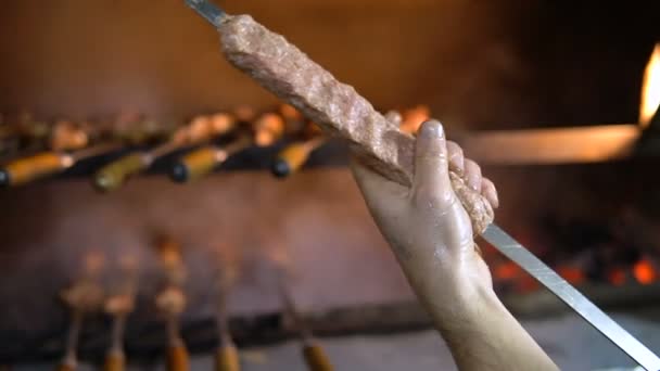 Barbecue grill. Hand cooking kebab on skewer close-up — Stock Video