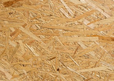 OSB çarşafı kahverengi ahşap parçalardan yapılmış, tahta zemin 2 'ye sıkıştırılmış.