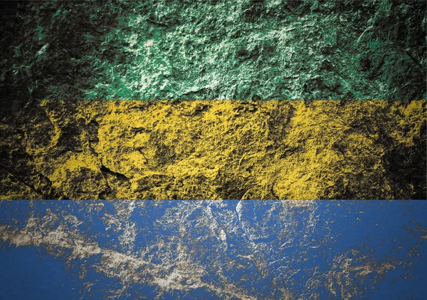 A Gaboni Köztársaság zászlaja a kőháttéren — Stock Fotó