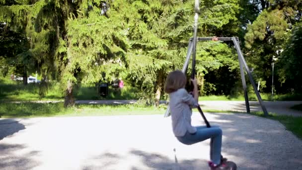 Children riding on zip line — Stock Video