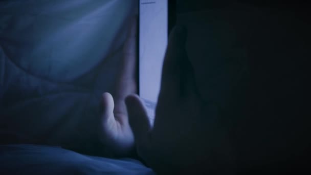 Boy under blanket with tablet — Stock Video