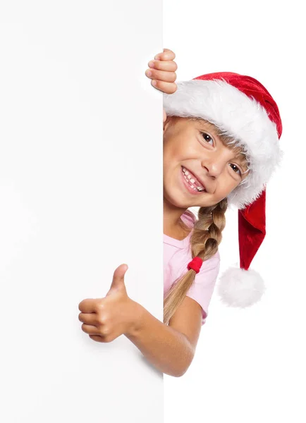 Glückliches kleines Mädchen mit Weihnachtsmütze — Stockfoto