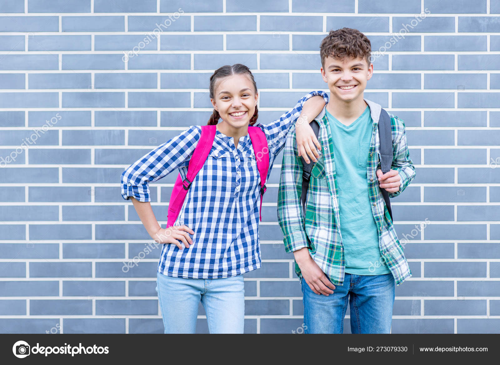 Teen boy and girl back to school Stock Photo by ©VaLiza 273079330