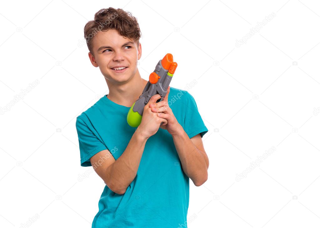 Teen boy with water gun
