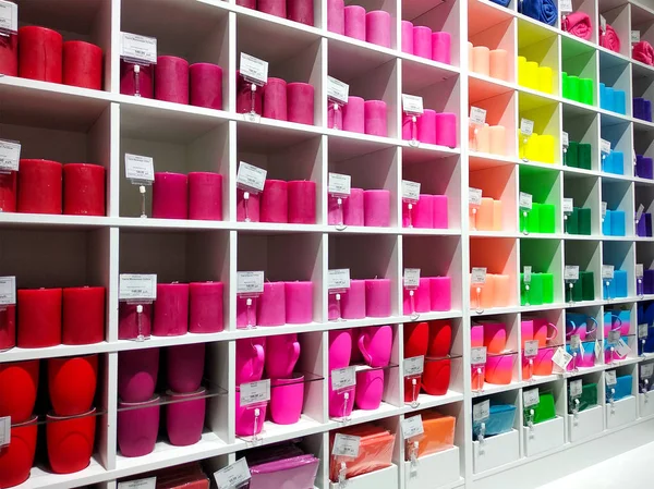 Multicolor store front or supermarket with candles and cups - sale, shopping, consumerism and people concept.