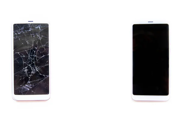 Marco para texto hecho de dos smartphones móviles con pantalla táctil de vidrio roto y fijo aislado en blanco. Concepto de servicio, reparación y tecnología — Foto de Stock