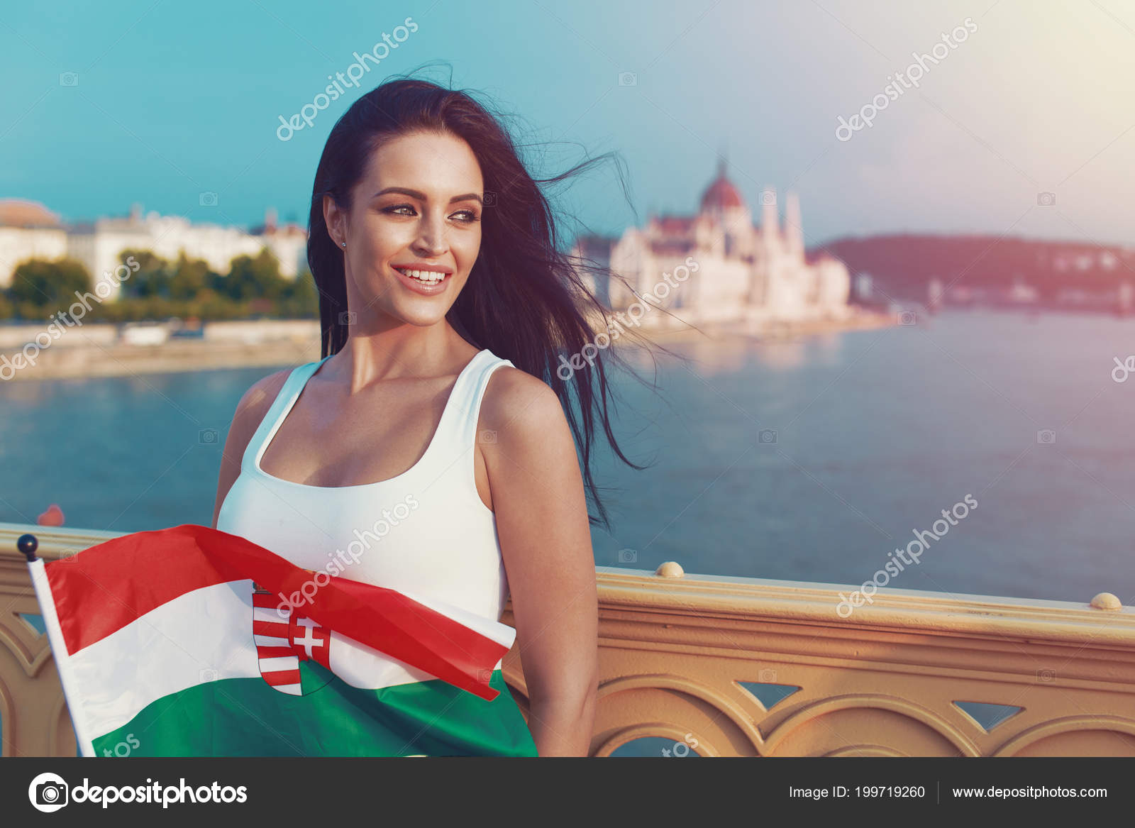 https://st4.depositphotos.com/1722785/19971/i/1600/depositphotos_199719260-stock-photo-young-brunette-woman-holding-hungarian.jpg