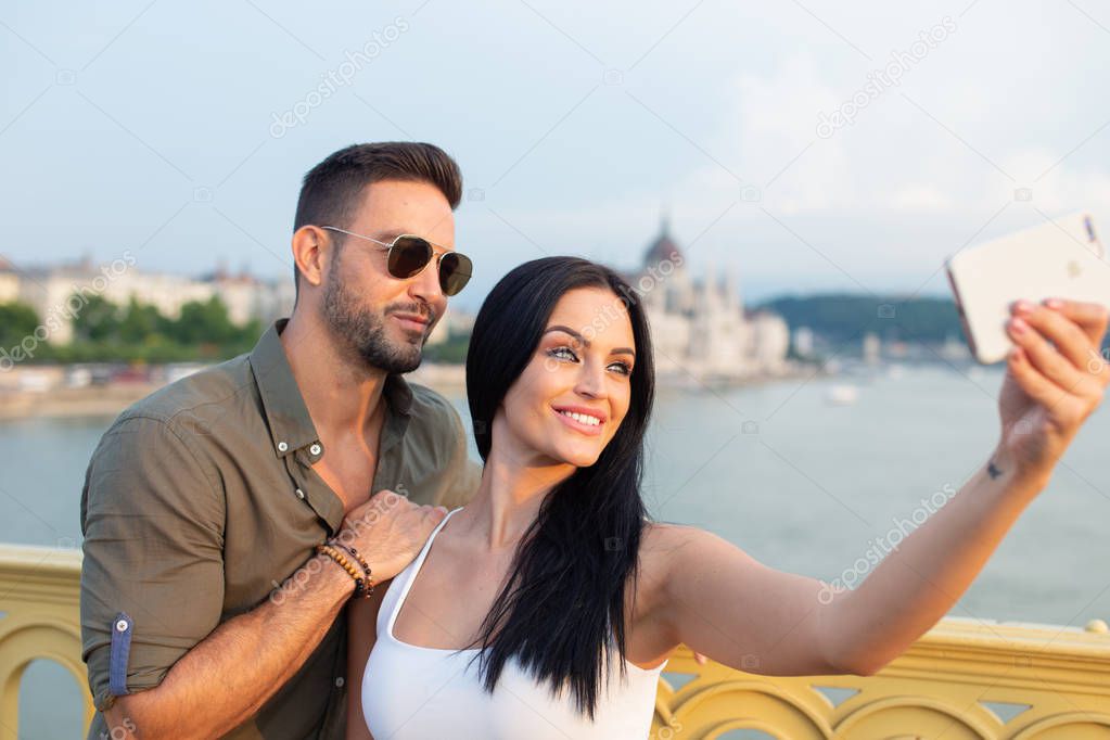 Happy young couple taking selfie at Budapest, Hungary