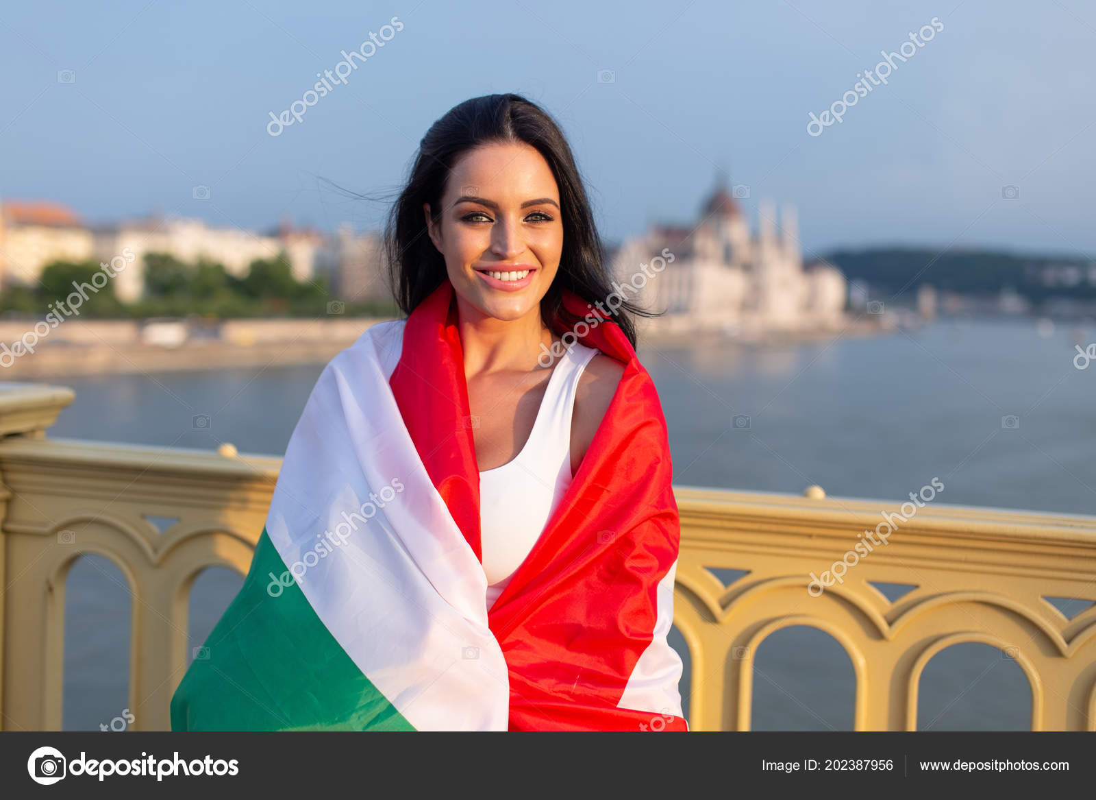 https://st4.depositphotos.com/1722785/20238/i/1600/depositphotos_202387956-stock-photo-happy-young-woman-covered-hungarian.jpg