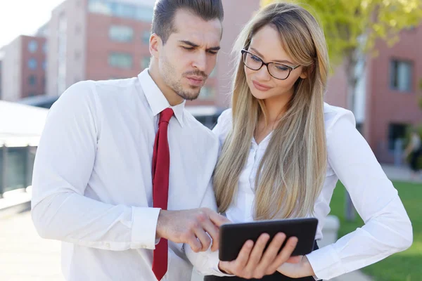 Serious Manager Showing Financial Data Tablet Coworker Colleague — Stock Photo, Image