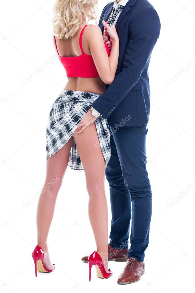 Sexy teacher with student romance isolated on white, blonde woman pulling man tie