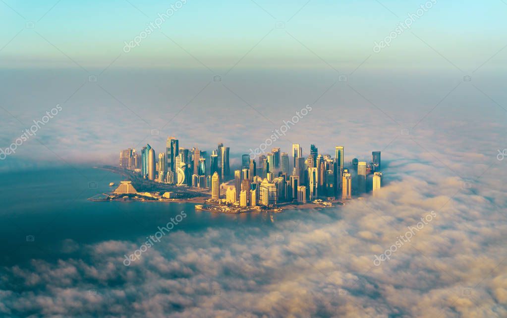 Aerial view of Doha through the morning fog, the capital of Qatar in the Persian Gulf