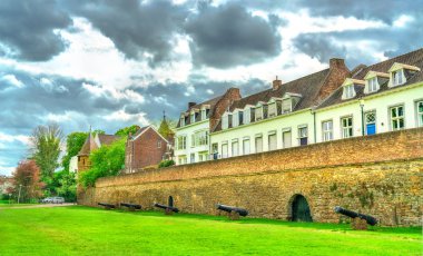 Medieval city wall with cannons in Maastricht, the Netherlands clipart